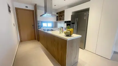 a kitchen with a counter with a bowl of fruit on it at Tropical Relaxing 2 Bedroom Unit with picuzzi in Punta Cana