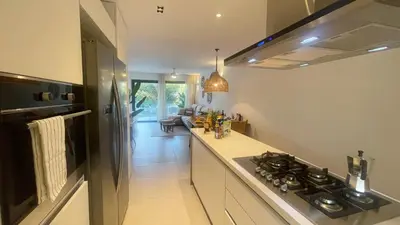 a kitchen with a stove and a counter top at Tropical Relaxing 2 Bedroom Unit with picuzzi in Punta Cana