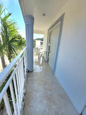 a balcony with a view of the ocean at Marmota House in Santa Bárbara de Samaná