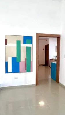 an empty room with a painting on the wall at Blue Island Punta Rucia in Punta Rucia