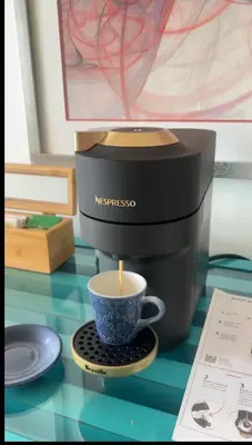 a coffee maker with a cup sitting on a table at Blue Island Punta Rucia in Punta Rucia