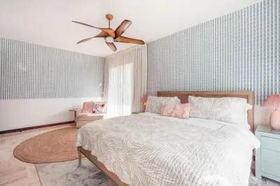 a bedroom with a bed and a ceiling fan at Comfortable and charming apartment at Portillo WF in Las Terrenas