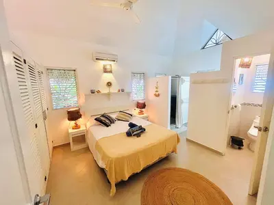 a bedroom with a large bed in a room at Villa Clarissa No. 8 in Las Terrenas