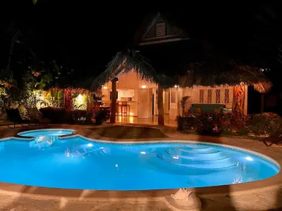 a swimming pool in a yard at night at Villa Clarissa No. 8 in Las Terrenas