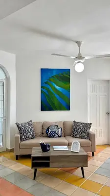 a living room with a couch and a coffee table at Dominicus Castillo Paradise in La Laguna