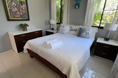 a bedroom with a bed with towels on it at Private Getaway - Sosua in Sosúa