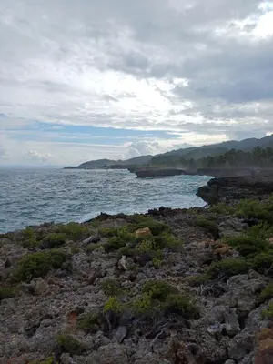 a body of water with a bunch of rocks at Mangobich in Punta Balandra