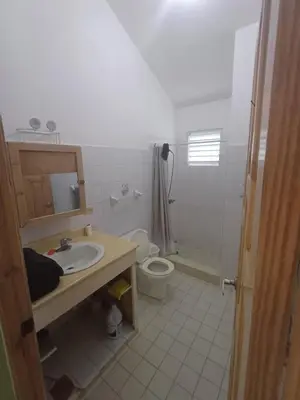 a bathroom with a sink and a toilet at Mangobich in Punta Balandra