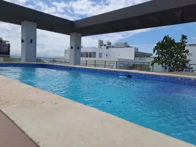 a swimming pool on top of a building at Goistay Elegant Refugio Caribeo 1br Gym Pool Naco in Santo Domingo