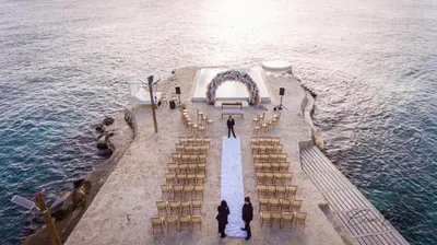 an overhead view of a wedding ceremony on the water at TRACADERO Beach Club & Holidays Rentals in Bayahibe