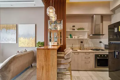 a kitchen with a counter and a table in it at S802 Lujoso Apartamento Downtown Santo Domingo RD in Santo Domingo