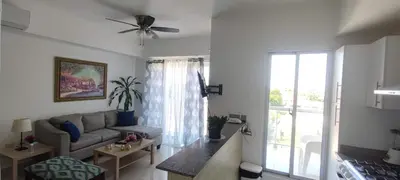 a living room with a couch and a window at Boca del Mar Residence, Boca Chica in Boca Chica