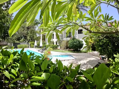 a view of the house from the garden at Coral Blanco Hotel in Sosúa