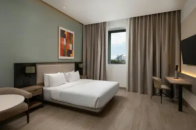 a hotel room with a bed and a desk at Residence Inn by Marriott Santiago de los Caballeros in Santiago de los Caballeros