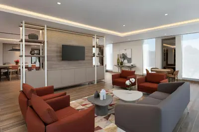 a living room with two couches and a tv at Residence Inn by Marriott Santiago de los Caballeros in Santiago de los Caballeros