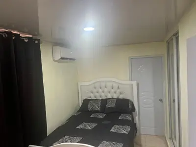 a small bedroom with a bed in a room at El anexos in Santiago de los Caballeros