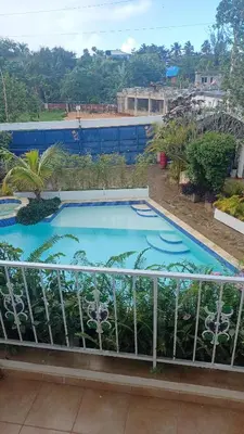 a large swimming pool on top of a balcony at Doña Mayra Aparta Hotel, Rustico in Las Terrenas