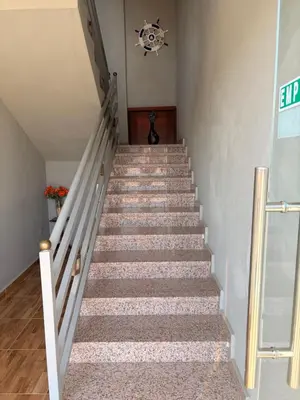 a staircase leading up to the top of a house at Hotel Vista al Morro in San Fernando de Monte Cristi