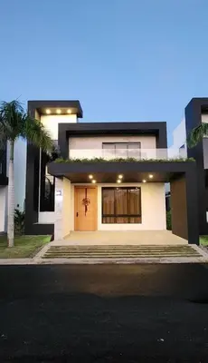 a white house with a front door and a palm tree at Exclusive Villa * private Beach and Housekeeping in Punta Cana