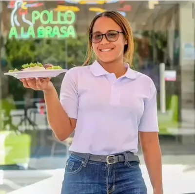 a woman in glasses holding a plate of food at Exclusive Villa * private Beach and Housekeeping in Punta Cana