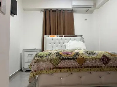 a bedroom with a bed with a quilt on it at Apartamento la familia 2 in Santa Bárbara de Samaná