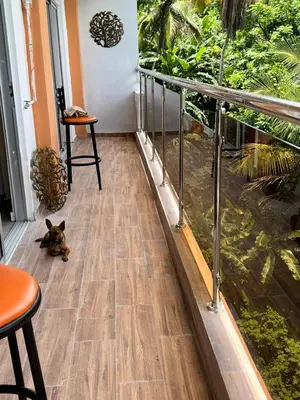 a dog laying on the floor next to a fish pond at Apartamento la familia 2 in Santa Bárbara de Samaná