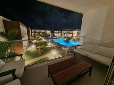a balcony with a view of a pool in a apartment at Escapada en Boca chica in Boca Chica