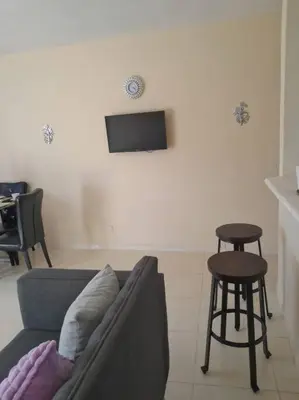 a living room with a couch and a table and stool at SDQ Apartamento Marbella 3 in La Ureña