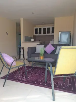 a living room with a couch and a table and chairs at SDQ Apartamento Marbella 3 in La Ureña