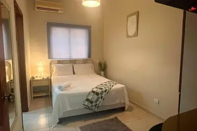 a small bedroom with a bed and a window at Hotel Plaza Kavia in Santo Domingo
