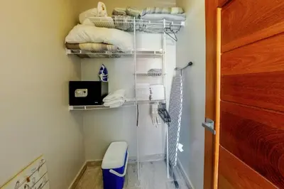 a bathroom with a closet with a toilet and towels at Corte Sea A302, Luxury Penthouse in Punta Cana