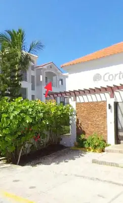 a white building with a gate and a fence at Corte Sea A302, Luxury Penthouse in Punta Cana