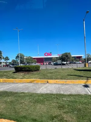 a person is walking in front of a store at Posada Mar azul in La Viva