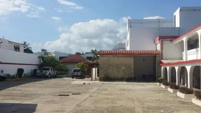 an empty parking lot in a city with buildings at Hotel Tropicana Santo Domingo in La Viva