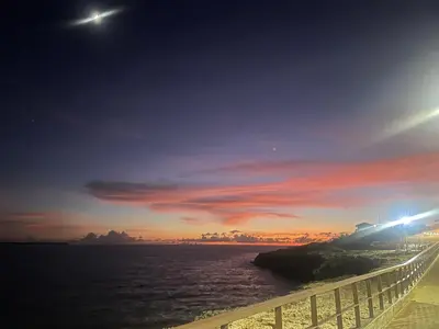 a bridge over a body of water at sunset at Cielo de cierro-Apartment with Jacuzzi, 2 minutes from the beach in La Romana
