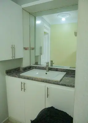 a bathroom with a sink and a mirror at Suite in San Pedro De Macoris in San Pedro de Macorís