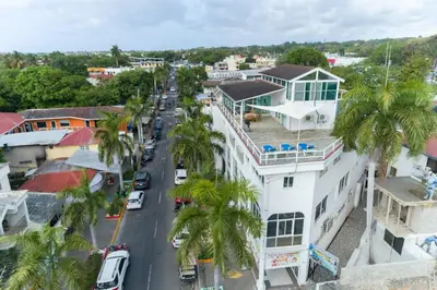 an aerial view of a city street with palm trees at Plaza Achim 6b, Modern Apt 250m From Sosua Beach in Sosúa
