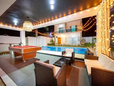 a pool room with a ping pong table and a pool table at 8br Private Villa In Sosa - 2 Mins From Nightlife in Sosúa