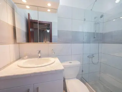a bathroom with a toilet and a sink and a shower at 7br Massive Villa In Sosa - 2mins From Nightlife in Sosúa