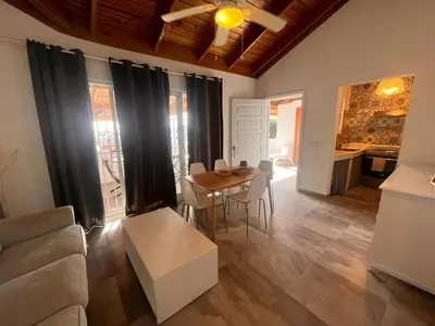 a living room with a table and a couch at Vittoria's House 402 in Bayahibe