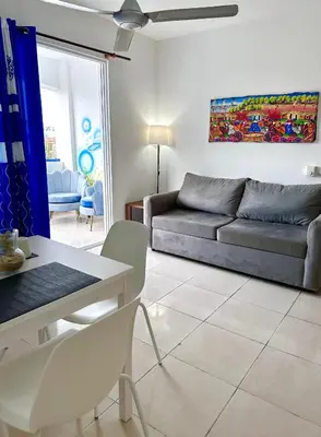 a living room with a couch and a table at Playa Azul House in Bayahibe