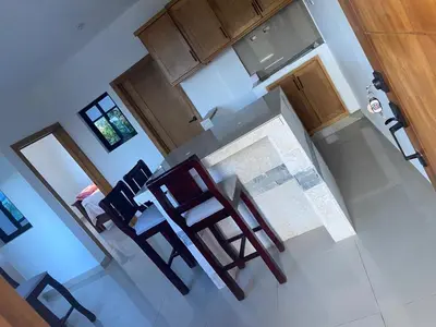 an overhead view of a kitchen with a table and chairs at Apartamento JGB 2 in Sosúa