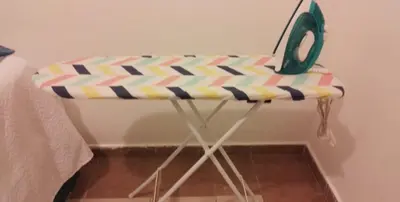 a table with a iron on top of it at Cozy & Spacious Apartament Boca Chica Beach in Boca Chica