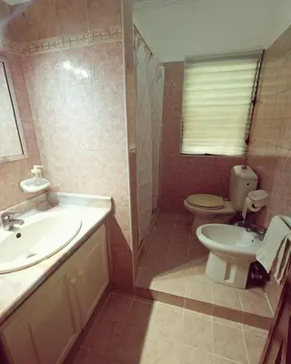 a bathroom with a sink and a toilet and a sink at Cozy & Spacious Apartament Boca Chica Beach in Boca Chica