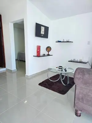 a living room with a couch and a table at hermoso apartamento céntrico in San Felipe de Puerto Plata