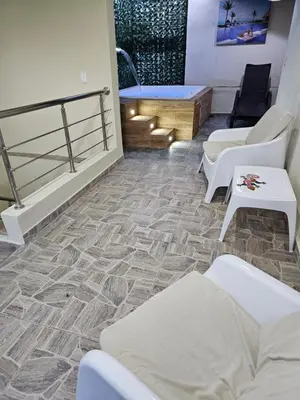 a room with couches and tables on the floor at hermoso apartamento céntrico in San Felipe de Puerto Plata