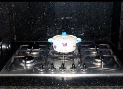 a pot sitting on top of a stove at Sturning Ocean View. in Santo Domingo