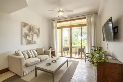 a living room with a couch and a table at Wonderful 1-BR apartment at Casa de Campo in El Infiernito