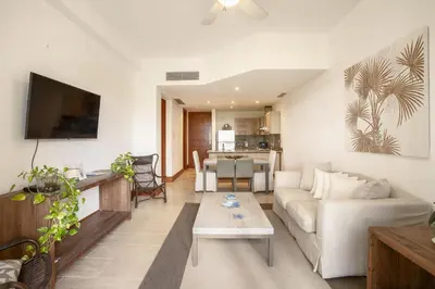 a living room with a couch and a table at Wonderful 1-BR apartment at Casa de Campo in El Infiernito