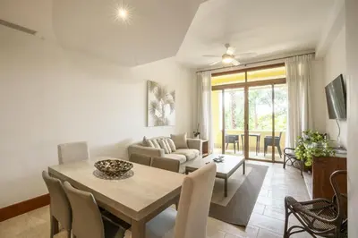 a living room with a table and chairs and a couch at Wonderful 1-BR apartment at Casa de Campo in El Infiernito